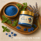 Hand holding Nila Moroccan Blue Clay Powder near face mask bowl